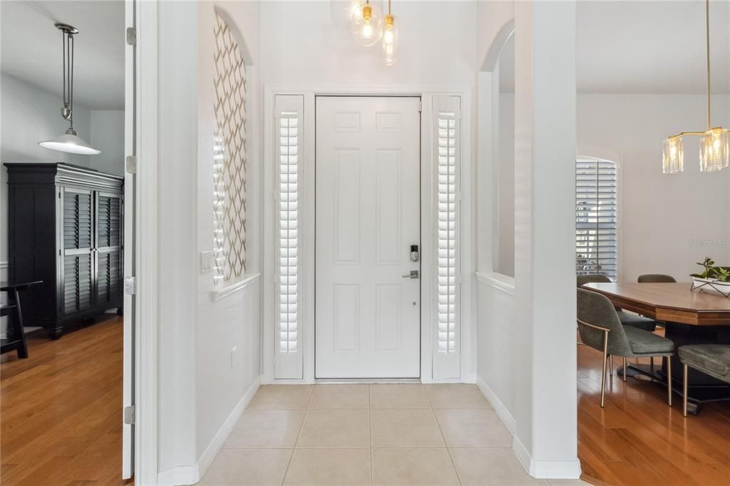 Welcoming Open foyer with vaulted, cathedral ceiling bringing in plenty of bright natural light and new interior paint setting the tone for an elegant and light filled atmosphere throughout the home, plantation shutters. This custom estate home boasts approximately 2,981 square feet of living space, with four bedrooms and three bathrooms.