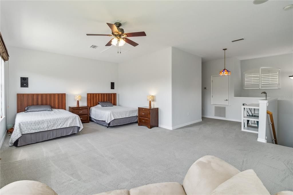 Fourth upstairs bedroom, featuring updated carpet installed in 2019 and professionally cleaned in 2024. This spacious bonus room is versatile enough to fit two full-size beds, offering ample space for bedroom, media room, office, in-law suite to accommodate all your needs.