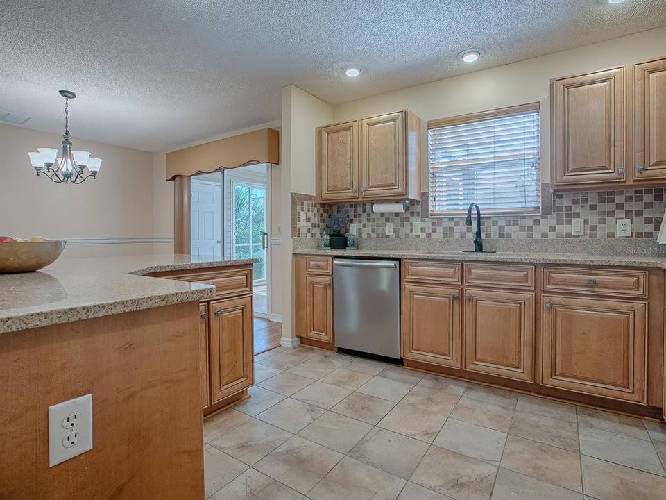 Kitchen has been remodeled with granite countertops, Bosch d/w, stainless sink & cabinets with pullouts