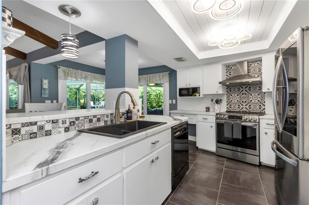 Gorgeous Kitchen with Two High Impact Sliders to the Pool