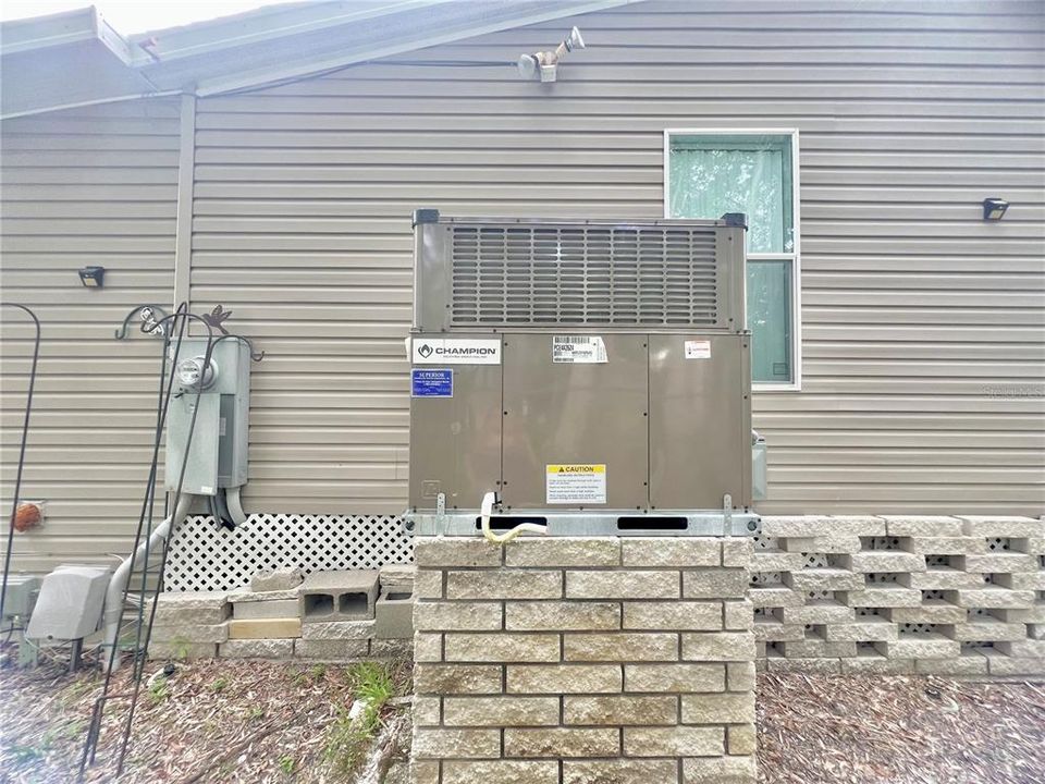 New A/C unit on exterior of home