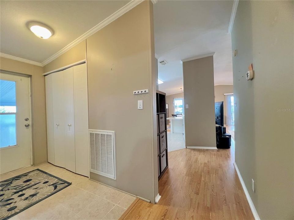 Hallway entry with laundry closet