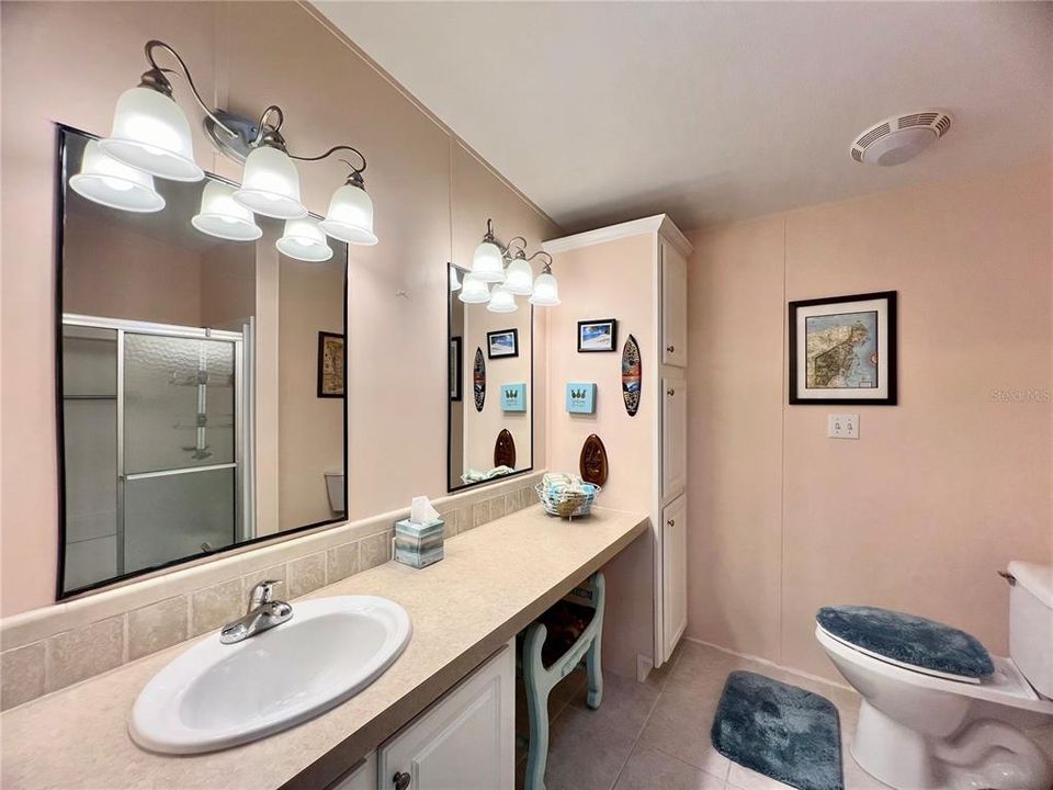 Primary ensuite bathroom with built in vanity