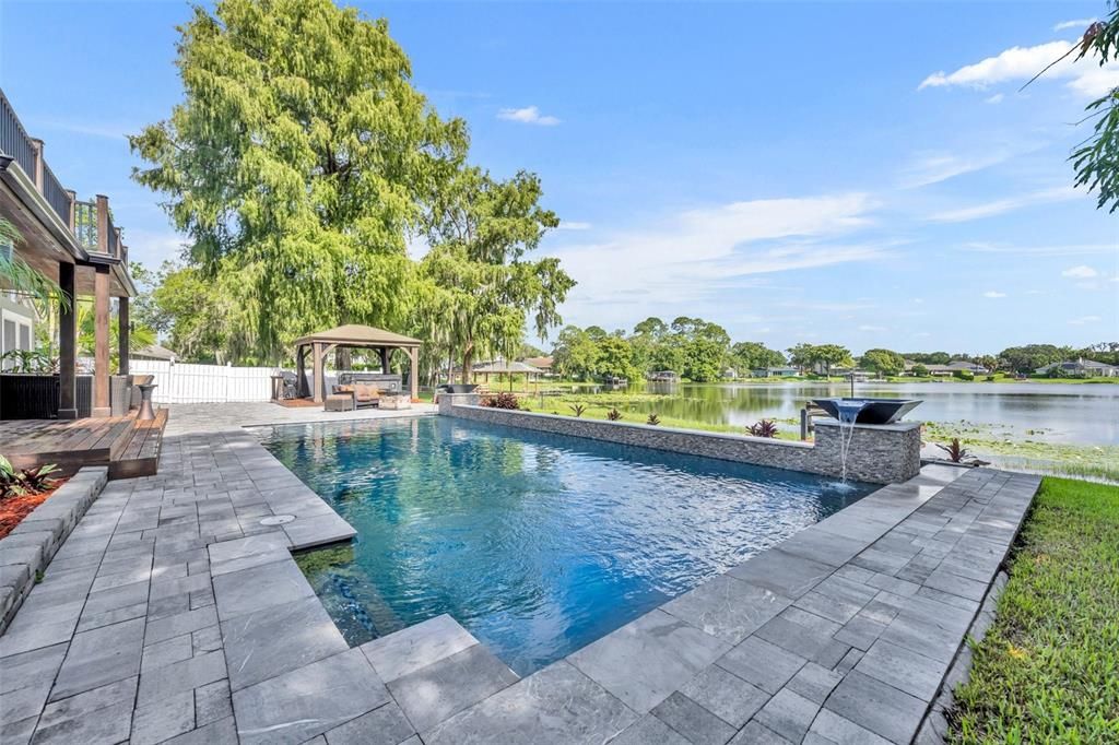 View of pool and covered spa area in the background