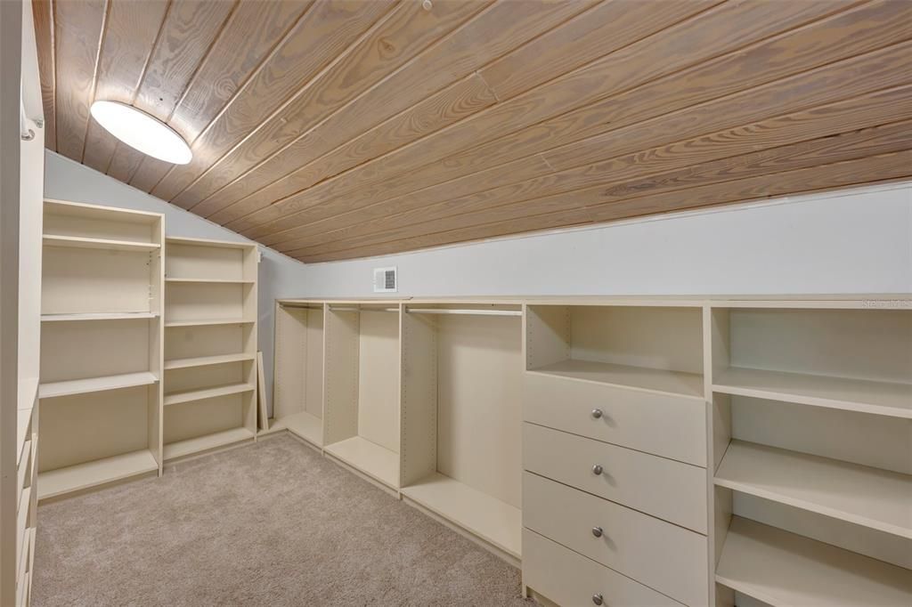 Large Master closet with tongue and groove ceiling