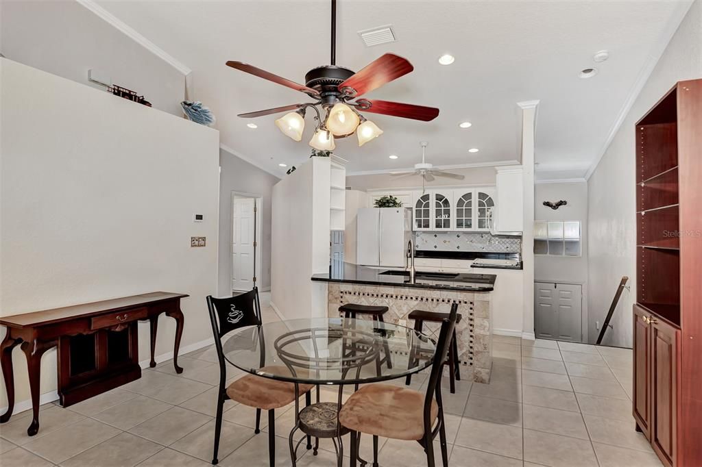 Dining area with breakfast bar close by