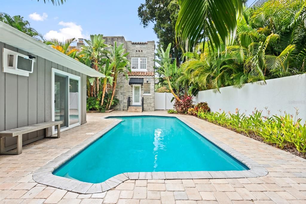 Outdoor shower and tropical landscaping create the perfect space.