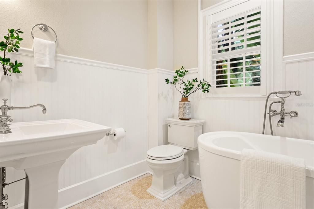 Full bathroom on the main floor adjacent to the downstairs bedroom.