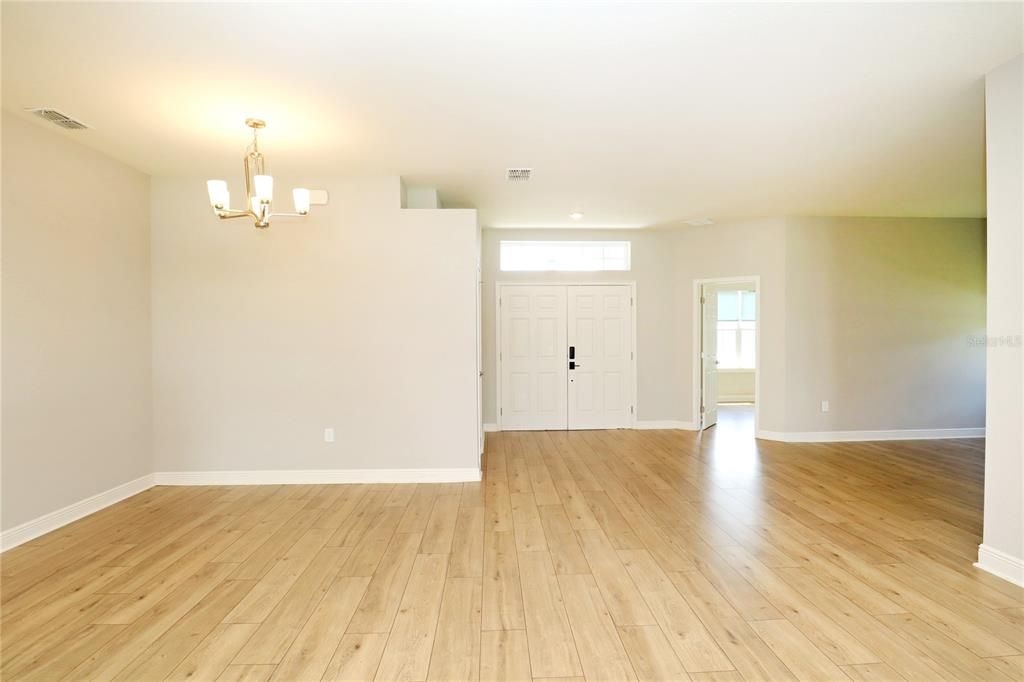 dining and foyer and door to 5th bedroom