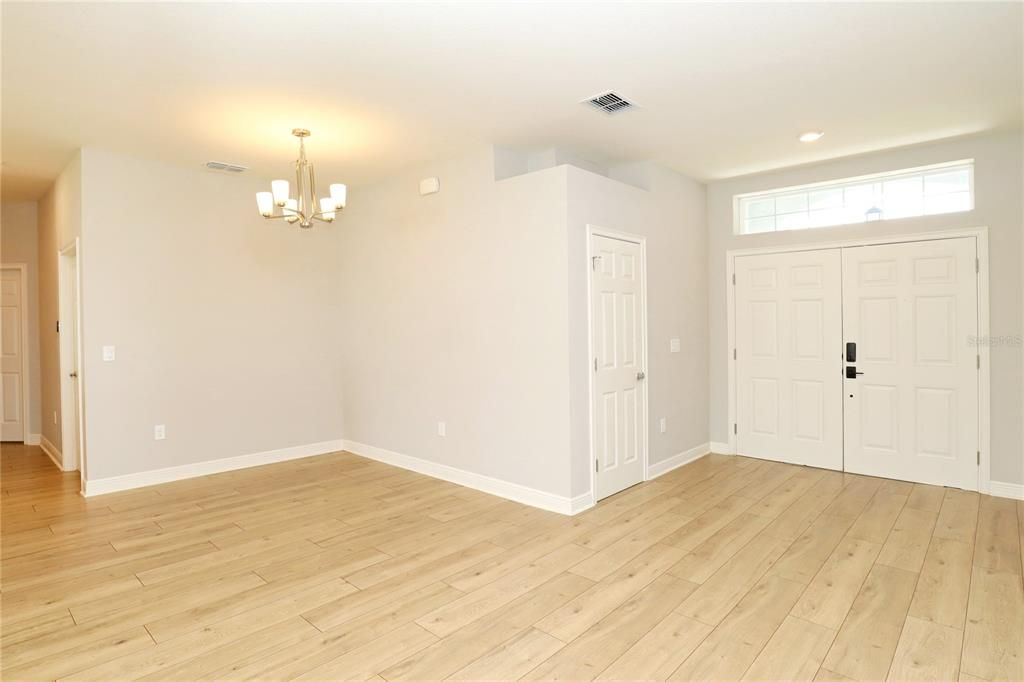 dining and foyer and door to 5th bedroom