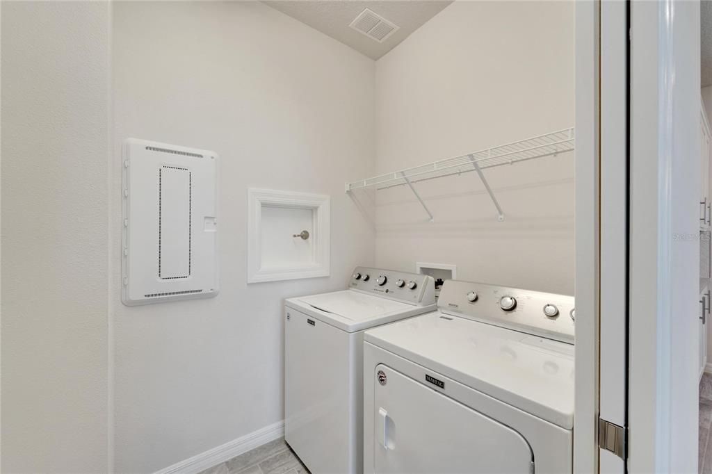 Laundry room with storage area