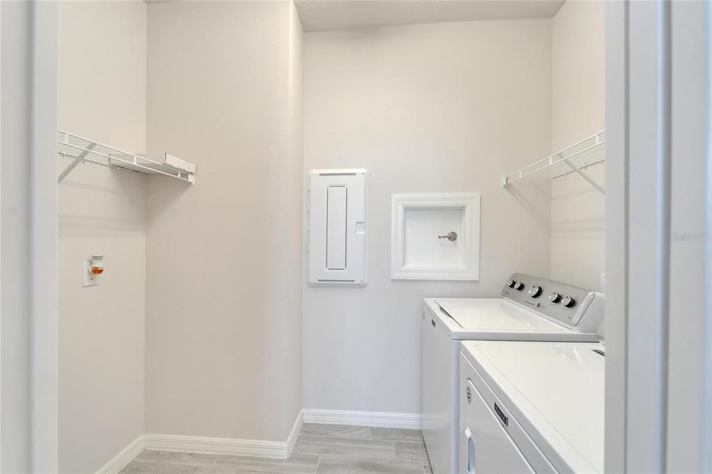 Laundry room with storage area