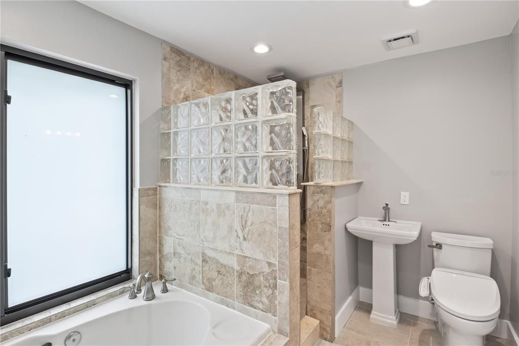 Master bath with jacuzzi tub, large walk in shower.