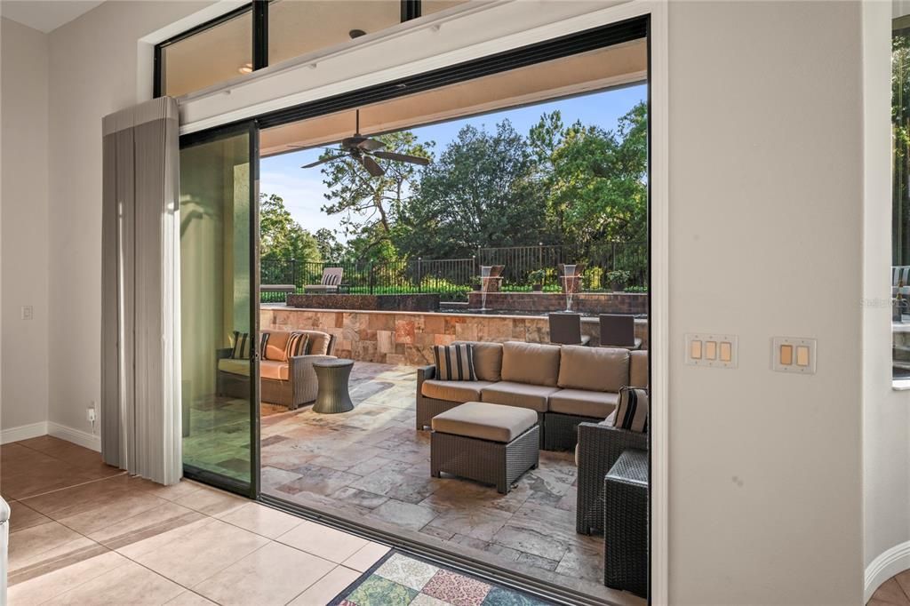 Double Door Slider from the Living Room to the Custom Pool  and Outside Covered patio