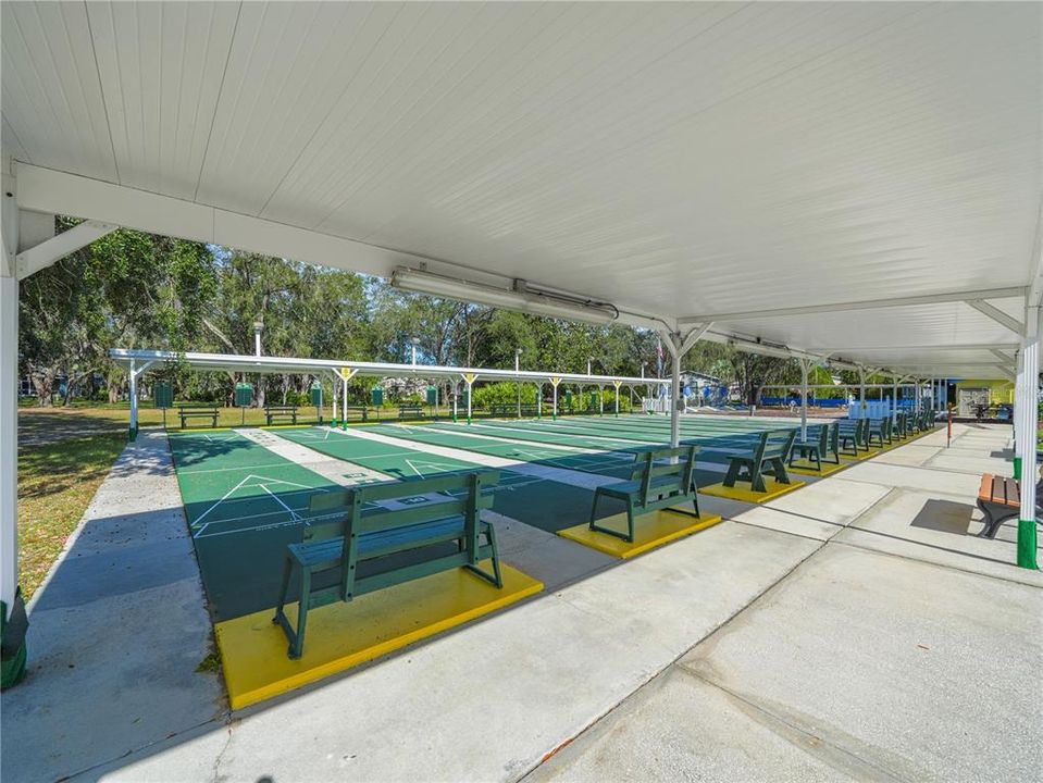 Play shuffleboard on the shaded courts.