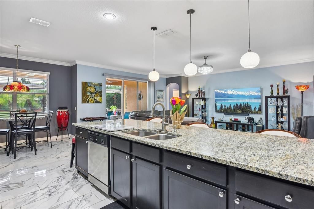 Kitchen overlooks the Main Family Room and Living Areas