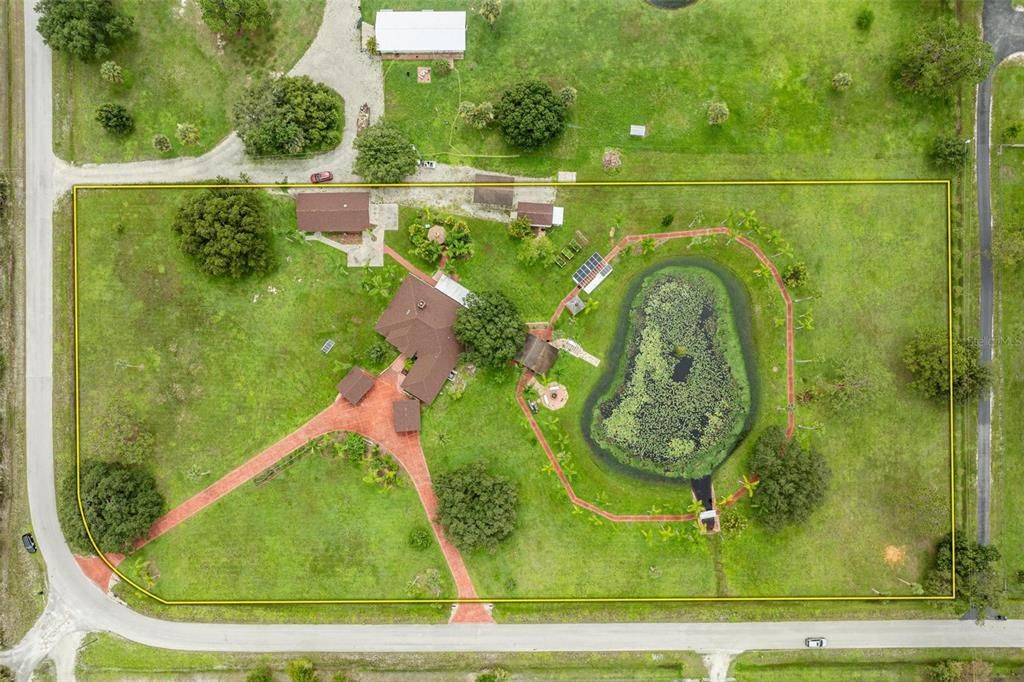 Gravel driveway, and boathouse featured at top of property photo is within this homes property line.