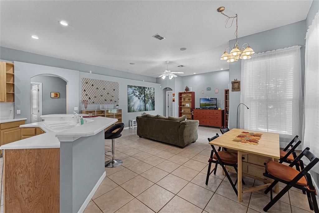 View of kitchen looking out to the family room and breakfast nook