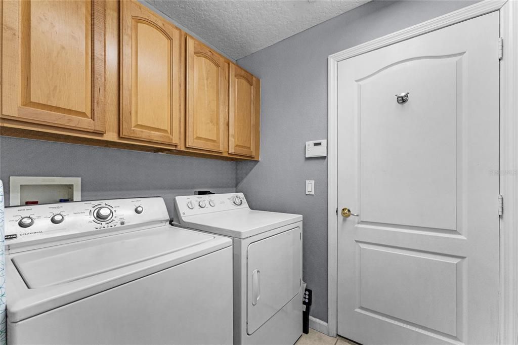 Indoor laundry room with utility sink