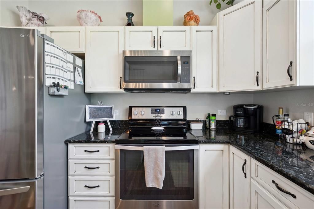 Chef's Kitchen with stainless appliances, granite, a large island and MUCH more!