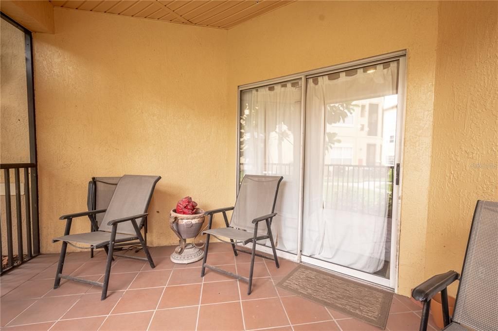 Sliding glass doors lead to the screened in patio.