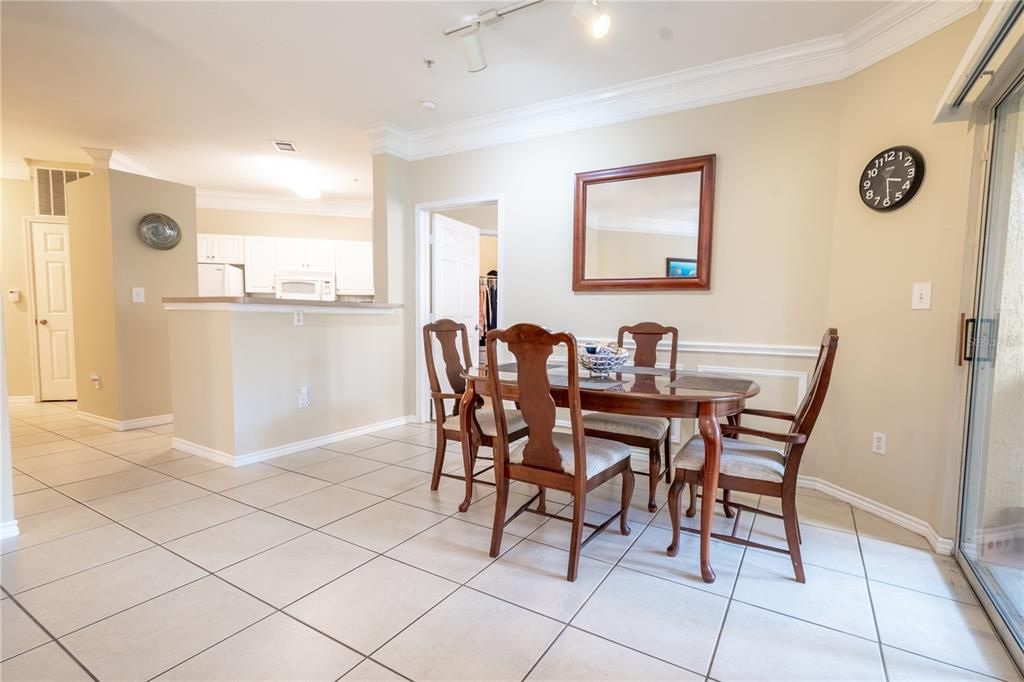 The spacious dining area is conveniently located next to the kitchen.