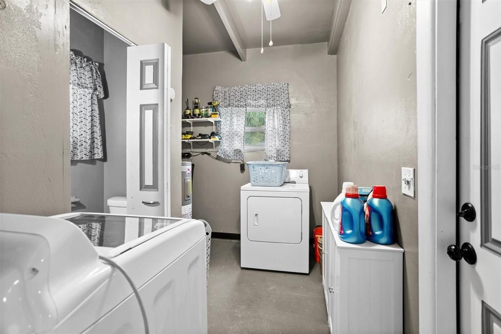 Large Indoor Laundry Room with Laundry Sink