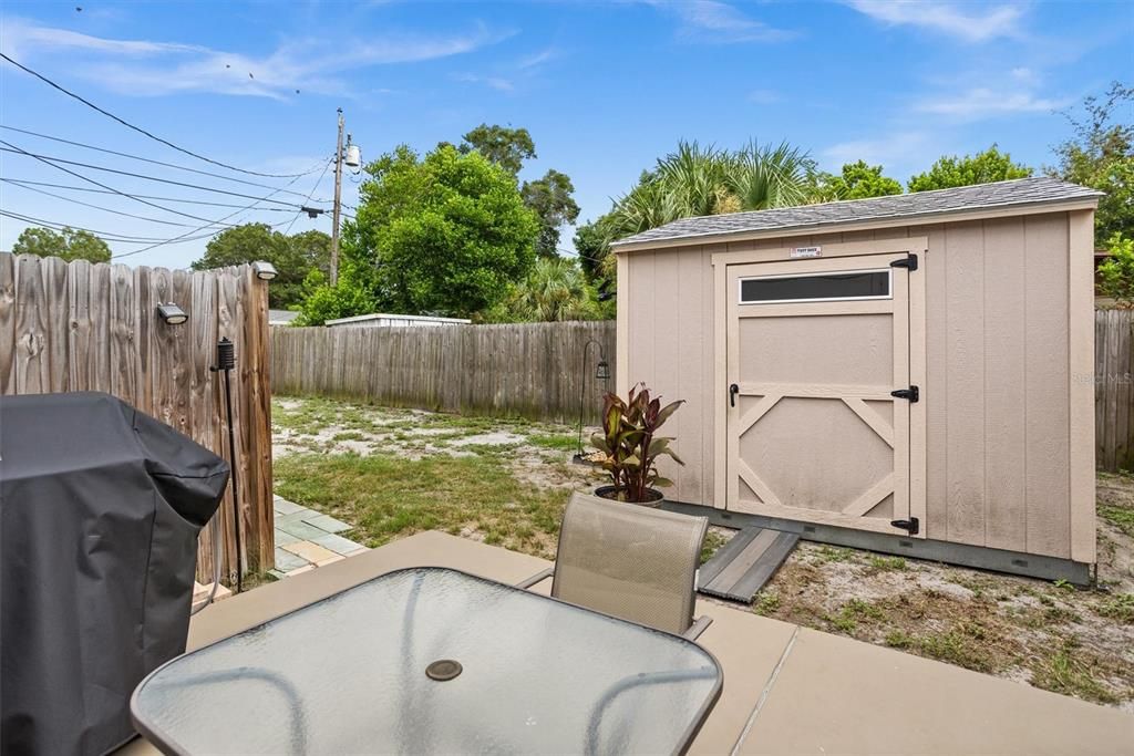 Patio with yard space and 10 x 10 Shed