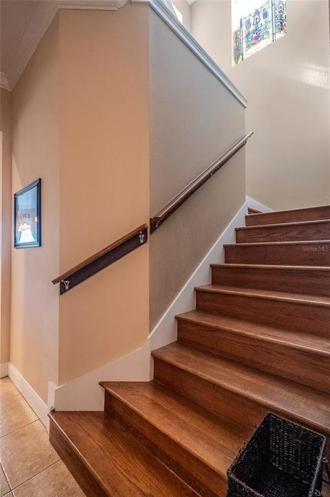 This stairwell is 42" wide and you should not have issues getting furniture  and attic items up this beautiful staircase.