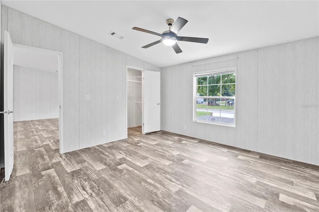 Primary Bedroom w/ view of Walk-In Closet