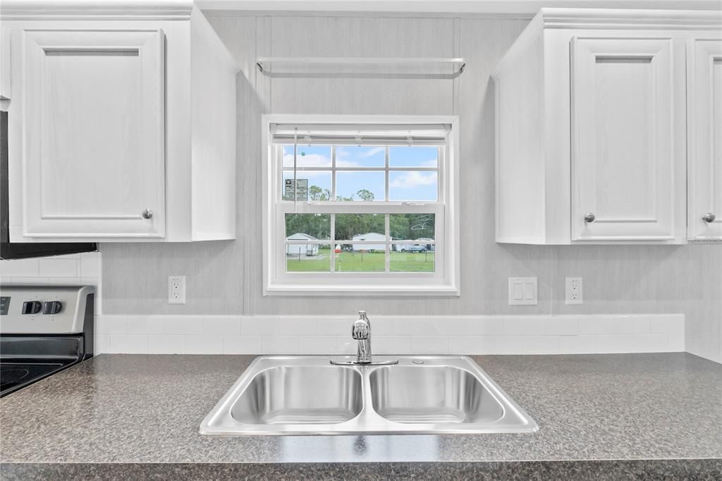 Kitchen Sink w/ view of Back Yard