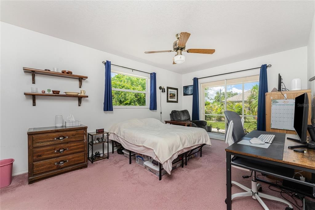 Master bedroom has another set of sliding glass doors leading to the lanai.