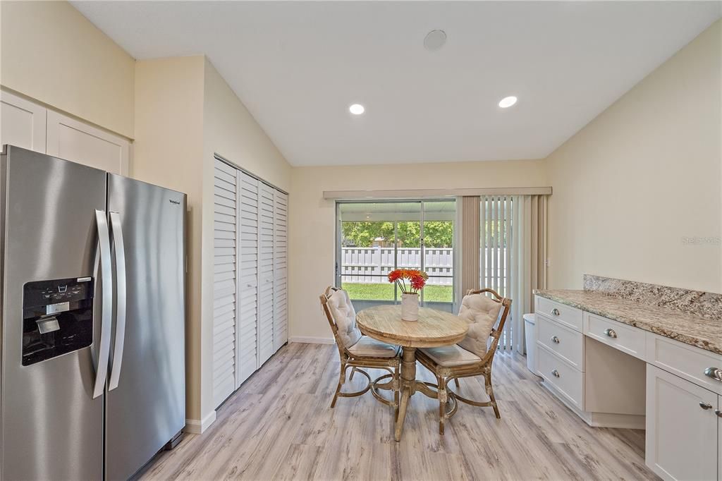 Kitchen to back patio screened