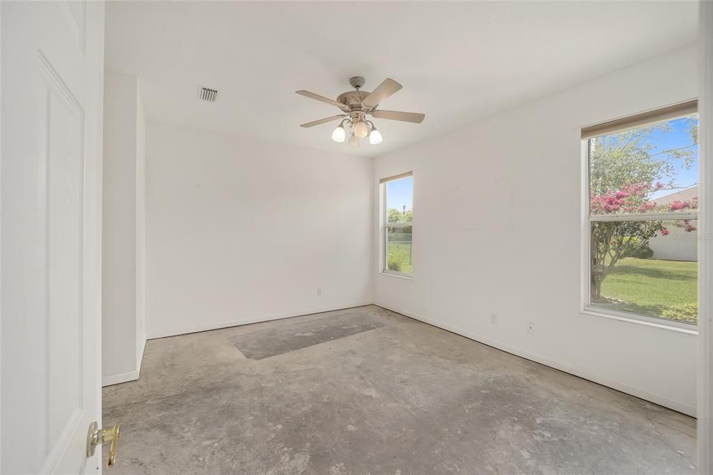 Primary bedroom looking at back yard