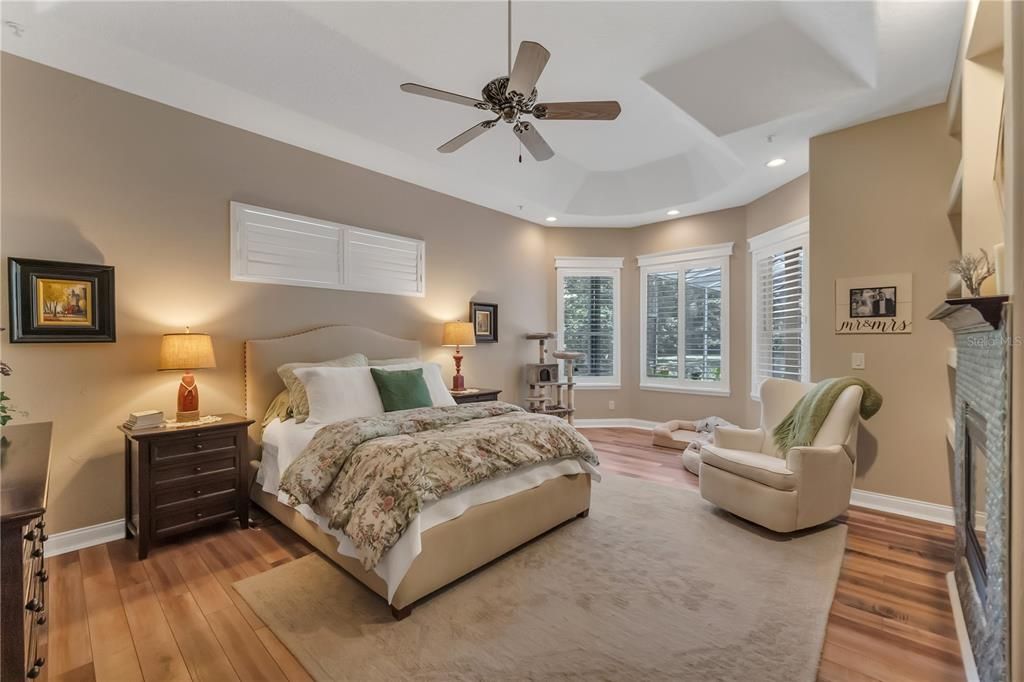 Master bedroom with views of the pool and large backyard