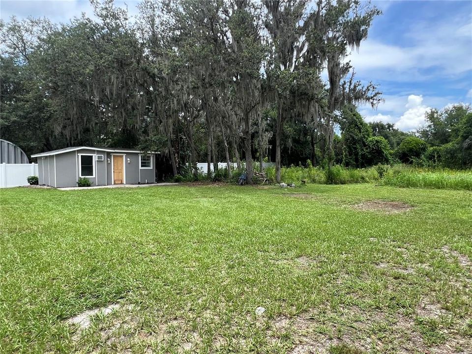 Another additional room and bathroom. Enjoy the half acre.