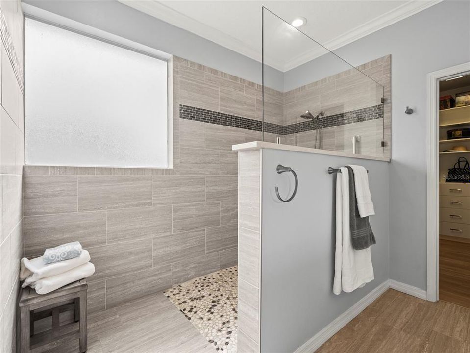 New oversized shower with dressing/drying space is also designed for wheelchair access