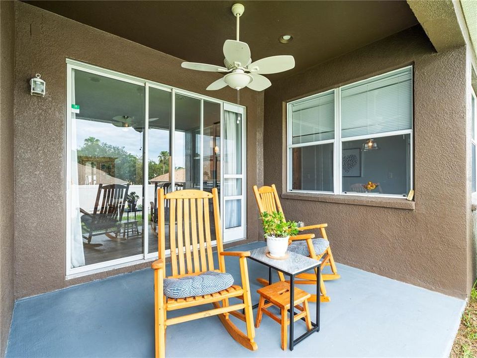 Florida living at its best! Enjoy your favorite drink or cup of morning coffee on your newly painted floor of the back patio.  Easy access in and out of the home.  *Pet sliding door insert does not convey.