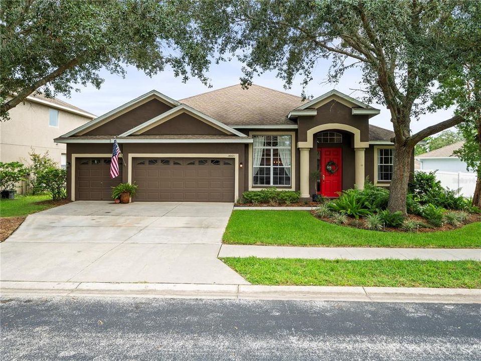 Lush, mature landscaping, neighborhood sidewalks, oversized driveway, and inviting neighborhood welcomes you to the warmth of this home!