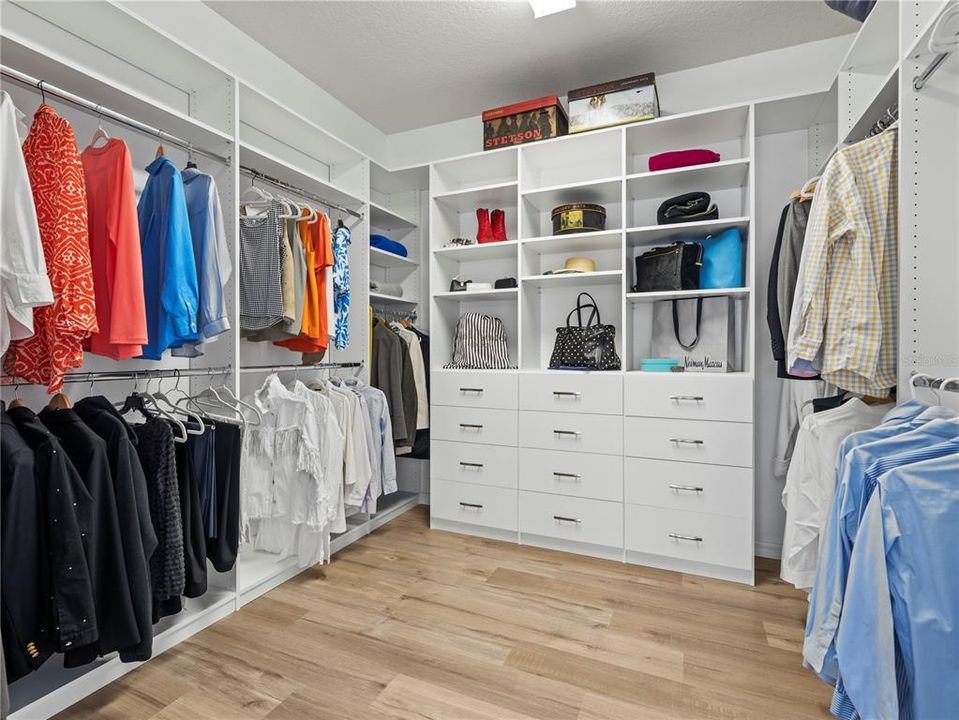 Custom closet/dressing room is amazingly large and functional with built in shelves, drawers, niches for storage.