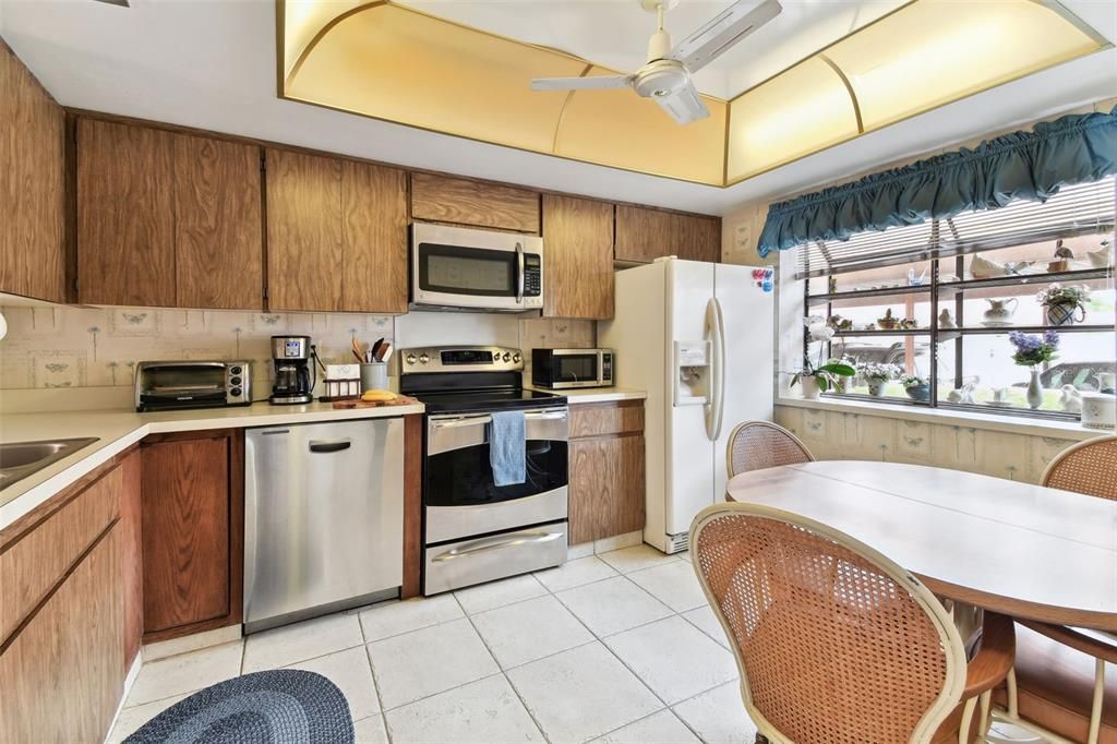 Kitchen has a window box and space for casual dining