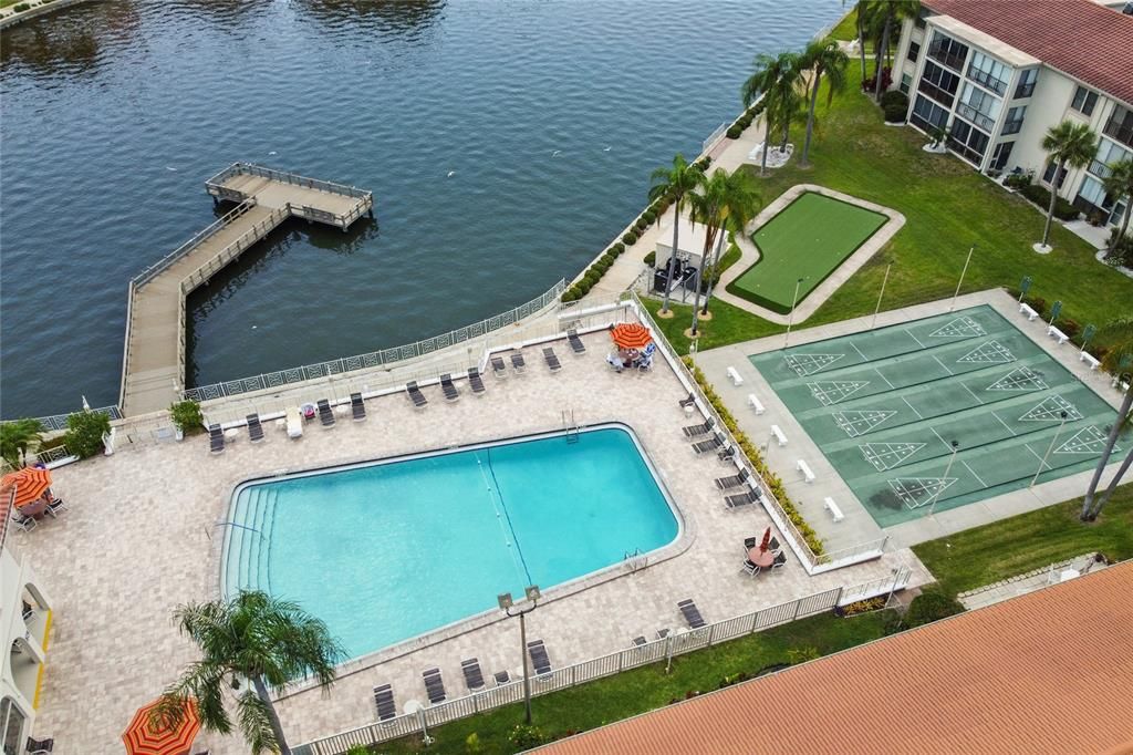 Community amenities overlooking the lagoon include a fishing pier, heated/chilled pool, shuffleboard, putting green, and grills.