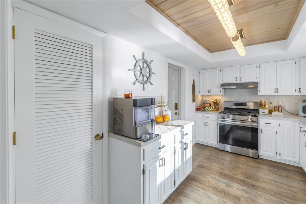 Kitchen/door to sizable pantry closet.