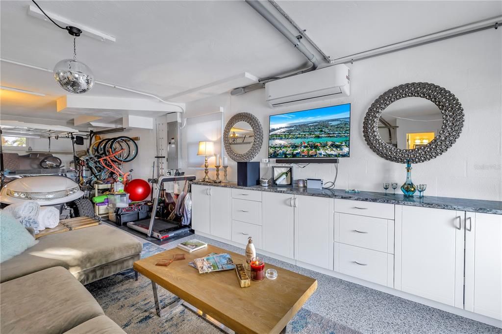 Marine grade cabinets in entire garage with granite counters t and a built in desk.