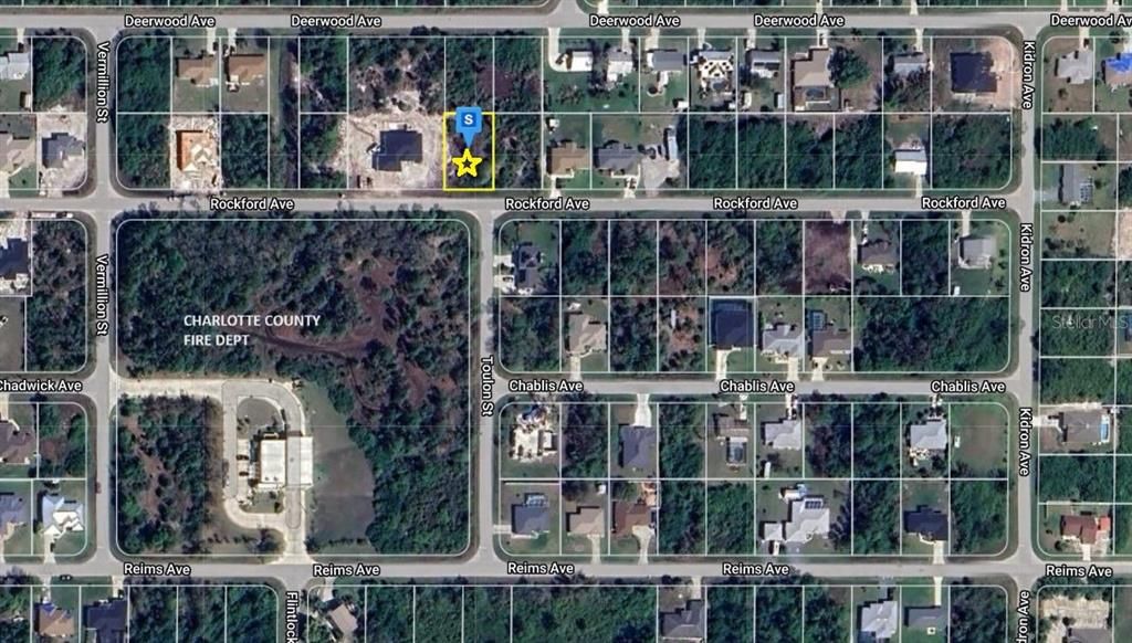 Google Satellite view of property directly across from Englewood Fire Station 75 land