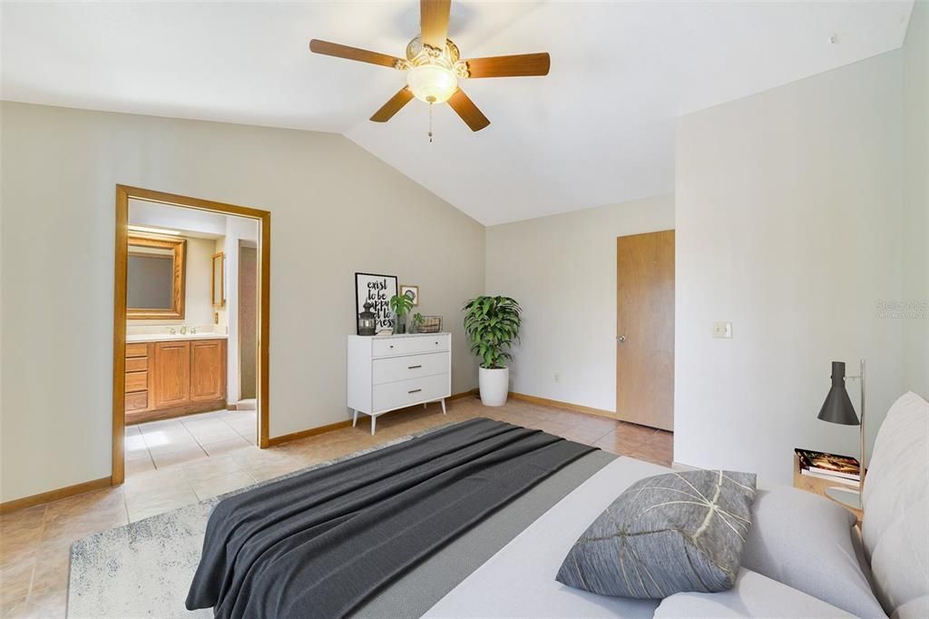 Ideal SPLIT BEDROOMS give the owner a tranquil retreat in the PRIMARY SUITE with a VAULTED CEILING, direct access to the lanai, WALK-IN CLOSET and private en-suite bath offering a DUAL SINK VANITY and oversized WALK-IN SHOWER. Virtually Staged.