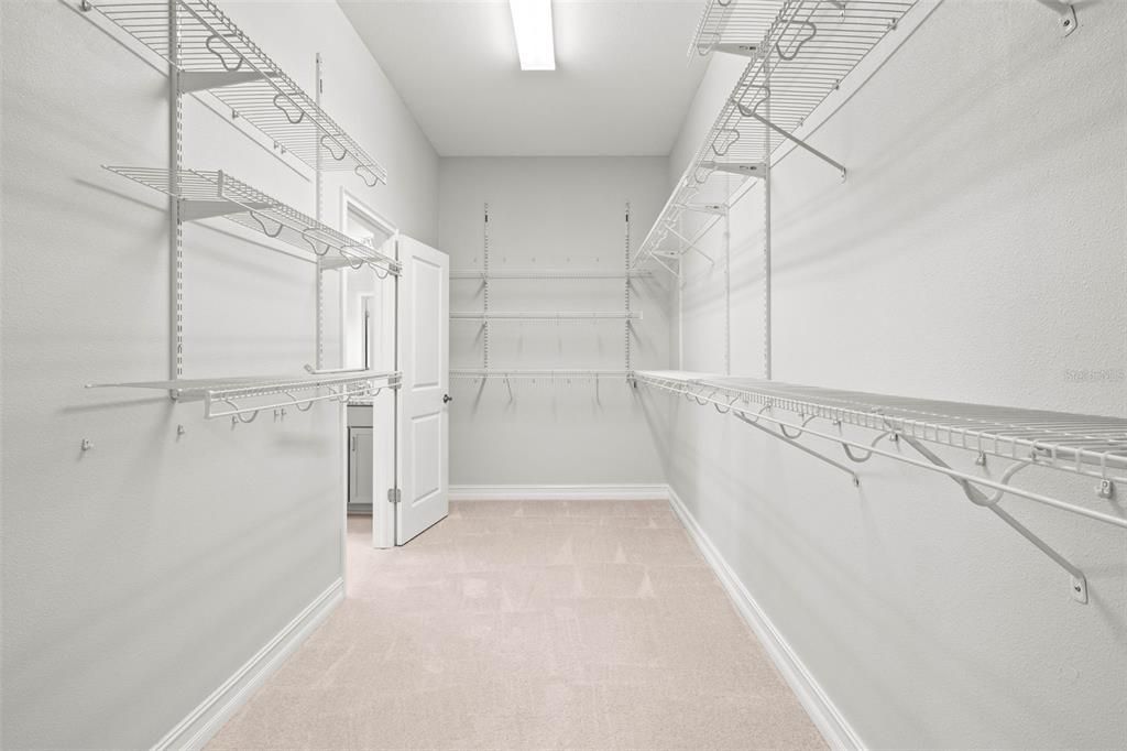 Primary bedrooms walk in closet