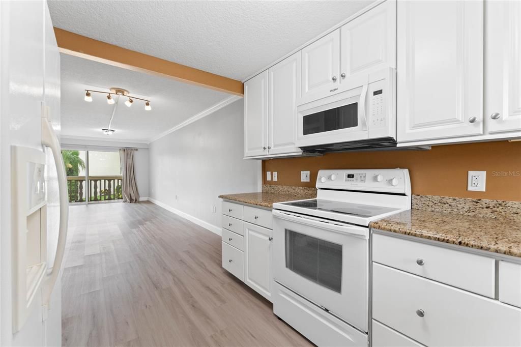 STORAGE DRAWERS TO RIGHT OF STOVE NICE AND DEEP VERY WELL LAID OUT KITCHEN