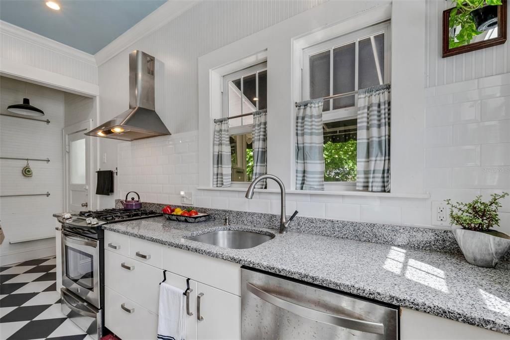 Remolded Kitchen with Gas Range, Granite Countertops and Walk in Pantry.