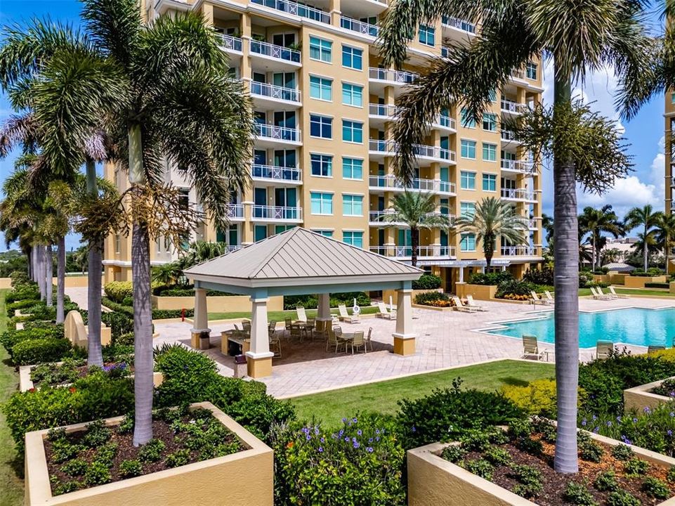 resort style pool, hot tub, grills and outdoor kitchen